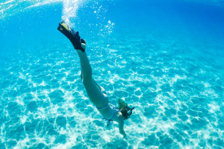 Beautiful Woman Snorkeling in Tropical Oceanの写真素材