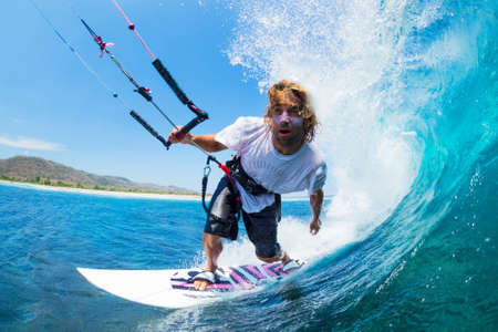 Extreme Sport, Kite Surfer Riding Wave getting Barreled
