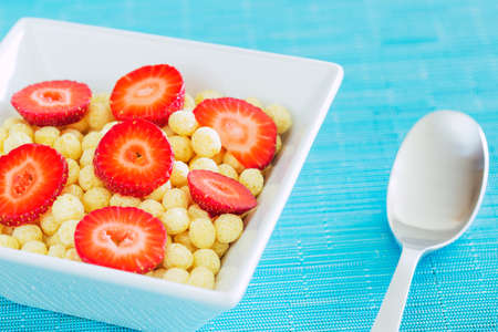 Bowl of Cereal with Fresh Strawberriesの写真素材