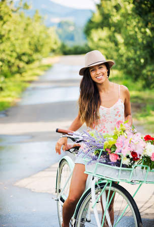 Beautiful Girl on Bike in Countryside, Summer Lifestyle の写真素材