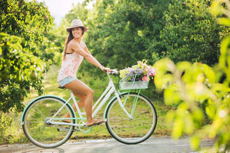 Beautiful Girl on Bike in Countryside, Summer Lifestyle の写真素材