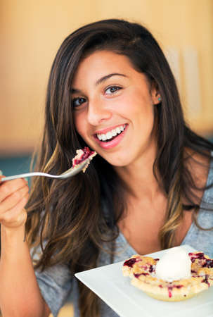Woman Eating Berry Pie and Ice Cream, Diet Conceptの写真素材