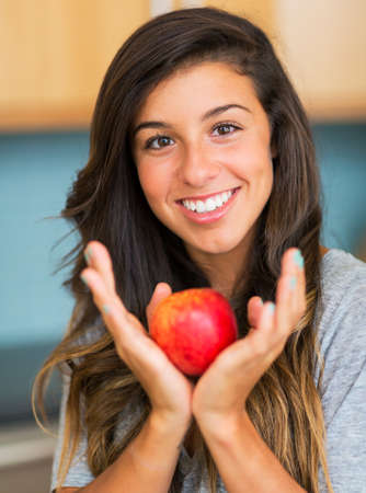 Portrait of beautiful woman with an apple, Healthy Lifestyle Conceptの写真素材