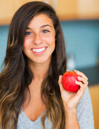 Portrait of beautiful woman with an apple, Healthy Lifestyle Conceptの写真素材
