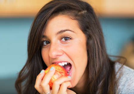 Portrait of beautiful woman with an apple, Healthy Lifestyle Conceptの写真素材