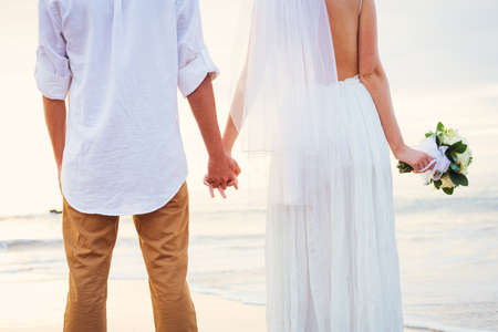 Bride and Groom, Romantic Newly Married Couple Holding Hands, Just Marriedの写真素材