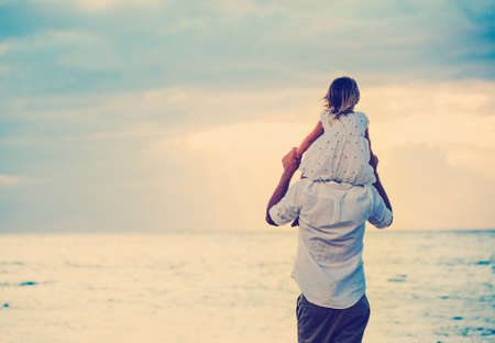 Father and Daughter Playing Together at the Beach at Sunset. Happy Fun Smiling Lifestyleの写真素材