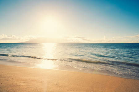 Beach and Tropical Sea in Hawaii at Sunsetの写真素材
