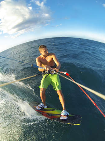 Kiteboarding, Fun in the Ocean, Extreme Sport. Action Camera POV angle.