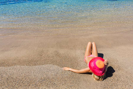 Beautiful woman relaxing on tropical beachの写真素材