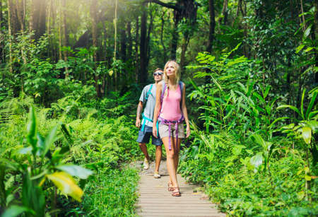 Attractive young couple having fun together outdoors on hikeの写真素材