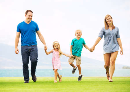 Happy Family Outside on Grassの写真素材