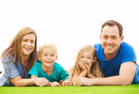 Portrait of Happy Family Outside on Grassの写真素材