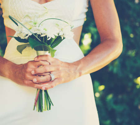 Beautiful Bride with Wedding Bouquet, Close up detail.の写真素材