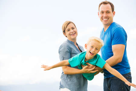Portrait of Happy Family Outside Playing