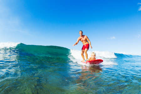 Father and Son Surfing Together. Riding Wave on Surfboard Tandem. Fatherhood, Family Fun Outdoor...