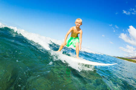 Young Boy Surfing Ocean Waveの写真素材