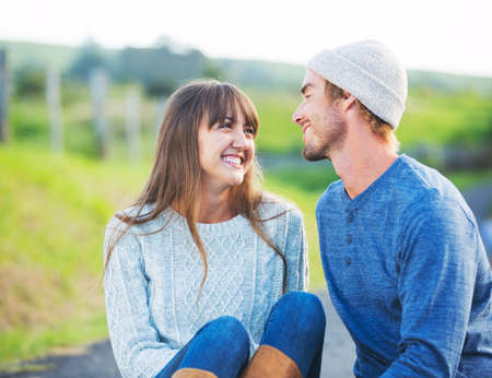 Happy Young Couple Having Fun Outdoors. Romantic Couple Kissing in Love.