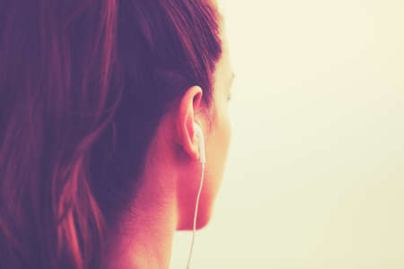 Active Sports Lifestyle with Modern Technology. Young fitness woman listening to musicの写真素材