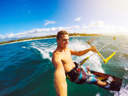 Kiteboarding. Fun in the ocean, Extreme Sport Kitesurfing. POV Angle with Action Cameraの写真素材