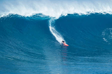 MAUI, HI - JANUARY 16 2016: Professional surfer Will Hunt rides a giant wave at the legendary big wave surf break known as "Jaws" on one the largest swells of the year.のeditorial素材