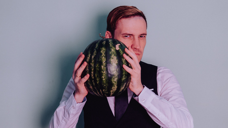 A man and a watermelon / Boy in classic suit with a watermelonの写真素材