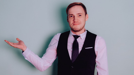 Happy attractive guy in classic suit with tie, very surprised. Man in shockの写真素材