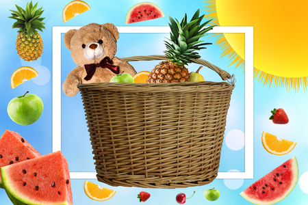 Picnic on a Sunny summer day, the picnic basket is filled with fruit. Daisies and the sun in the company of a Teddy bear on vacation. Toy and fruit in the basketの写真素材