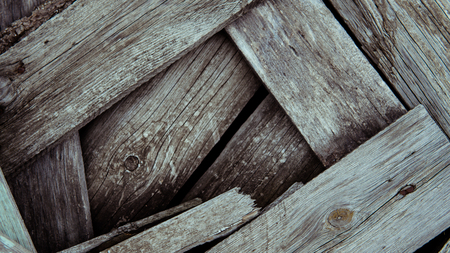 Multicolored wooden wall and blue sky. A colored wall of wood with a lot of copy space. Wooden fence and blue sky. Colored Painted Old Shabby Wooden Desk Background. Wooden Background.の写真素材