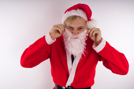 Emotional Santa Claus on a white background. Happy New Year and merry Christmas!の写真素材