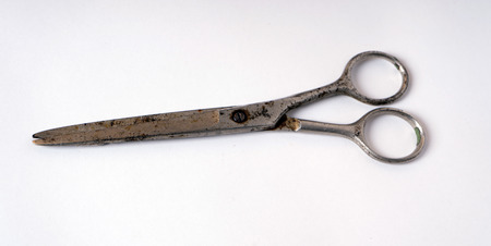 Old scissors lie isolated on white backgroundの写真素材
