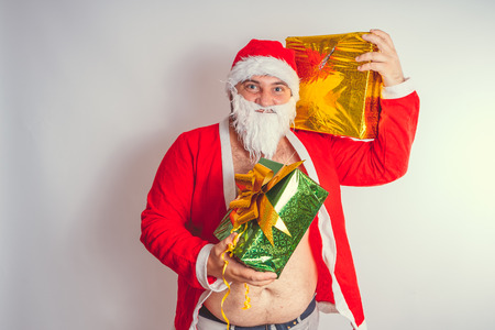 Thick emotional Santa Claus on plowing with bare torsoの写真素材