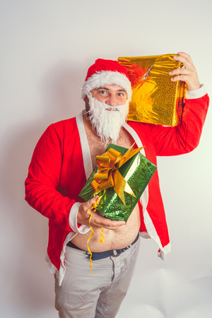 Thick emotional Santa Claus on plowing with bare torsoの写真素材