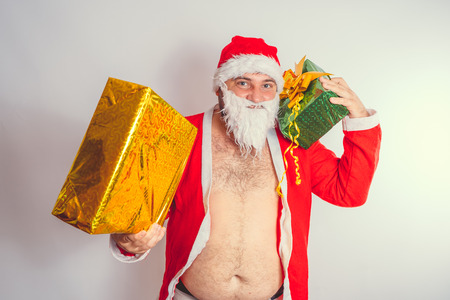 Thick emotional Santa Claus on plowing with bare torsoの写真素材