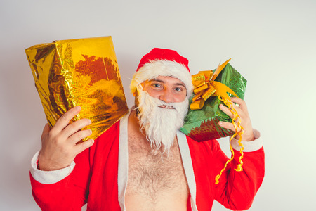 Thick emotional Santa Claus on plowing with bare torsoの写真素材