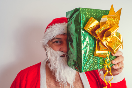 Thick emotional Santa Claus on plowing with bare torsoの写真素材