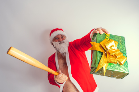 Thick emotional Santa Claus on plowing with bare torsoの写真素材