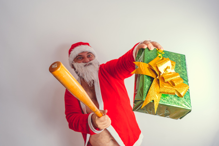 Thick emotional Santa Claus on plowing with bare torsoの写真素材