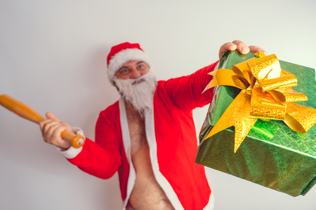 Thick emotional Santa Claus on plowing with bare torsoの写真素材