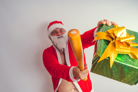 Thick emotional Santa Claus on plowing with bare torsoの写真素材