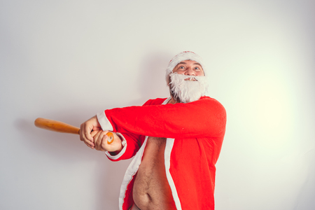 Thick emotional Santa Claus on plowing with bare torsoの写真素材