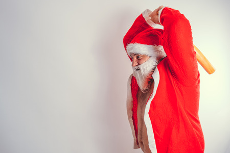 Thick emotional Santa Claus on plowing with bare torsoの写真素材