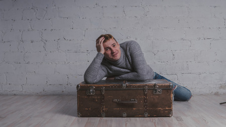 The guy with the suitcase, vacation package. Huge suitcase. Concept: vacation and vacation.の写真素材