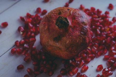 Red pomegranate wooden background, concept: fresh vegetables, healthy food.の写真素材