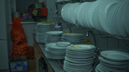 Lots of dirty dishes, after co-op or banquets. The concept of dirty cuisine in the restaurant.の写真素材