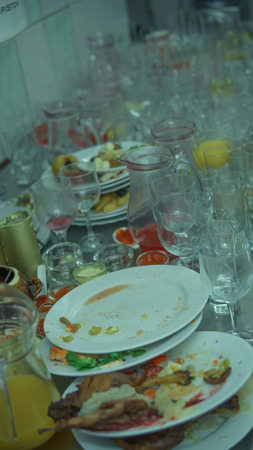 Lots of dirty dishes, after co-op or banquets. The concept of dirty cuisine in the restaurant.の写真素材