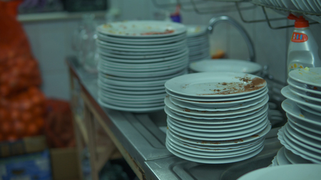 Lots of dirty dishes, after co-op or banquets. The concept of dirty cuisine in the restaurant.の写真素材