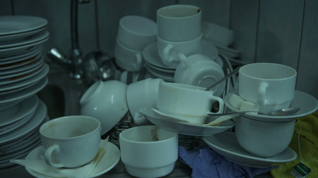 Lots of dirty dishes, after co-op or banquets. The concept of dirty cuisine in the restaurant.の写真素材