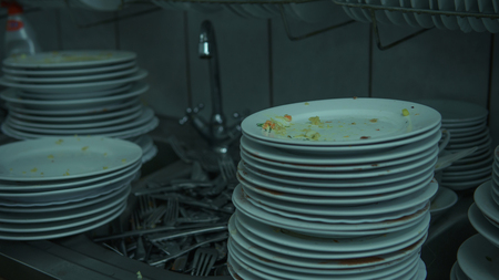 Lots of dirty dishes, after co-op or banquets. The concept of dirty cuisine in the restaurant.の写真素材