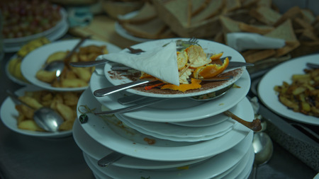 Lots of dirty dishes, after co-op or banquets. The concept of dirty cuisine in the restaurant.の写真素材